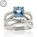 Aquamarine and Diamond Criss-Cross 10K Band (image for) Aquamarine and Diamond Criss-Cross 10K Band